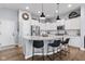 Bright kitchen with a large island, granite countertops, stainless steel appliances, and modern pendant lighting at 13245 E 131St St, Fishers, IN 46037