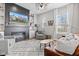 Cozy living room featuring a fireplace, large TV, and lots of natural light at 13245 E 131St St, Fishers, IN 46037
