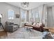 Bright and airy living room with an oversized rug and lots of natural light at 13245 E 131St St, Fishers, IN 46037