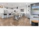 Bright, open floor plan with kitchen island, dining area and fireplace on a TV at 13245 E 131St St, Fishers, IN 46037