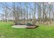 Peaceful park setting with benches nestled among lush green grass and mature trees, inviting relaxation at 13245 E 131St St, Fishers, IN 46037