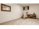 Cozy basement nook featuring a dresser and a comfortable armchair with a side table at 1395 Chatham Hills Blvd, Westfield, IN 46074
