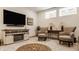 Finished basement space with a TV, seating, and a decorative fireplace at 1395 Chatham Hills Blvd, Westfield, IN 46074
