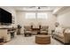 Finished basement with TV, seating area, and bright, natural lighting at 1395 Chatham Hills Blvd, Westfield, IN 46074