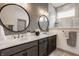 Modern bathroom featuring double vanity sinks, decorative mirrors, and luxurious walk-in shower at 1395 Chatham Hills Blvd, Westfield, IN 46074
