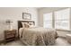 Cozy bedroom with a comfortable bed, side table and two windows providing ample natural light at 1395 Chatham Hills Blvd, Westfield, IN 46074