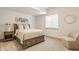 Well-lit bedroom featuring neutral colors and a comfortable bed with under-bed storage at 1395 Chatham Hills Blvd, Westfield, IN 46074