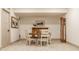 Basement dining area with a wood table, white chairs and an antique grandfather clock at 1395 Chatham Hills Blvd, Westfield, IN 46074