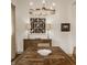 Lovely dining room with wooden table, chandelier, and stylish decorations and lighting at 1395 Chatham Hills Blvd, Westfield, IN 46074