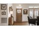 Elegant entryway featuring hardwood floors, stylish decor, a light-filled ambiance, and a wooden front door at 1395 Chatham Hills Blvd, Westfield, IN 46074