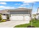 Spacious three-car garage with ample parking and a well-manicured lawn at 1395 Chatham Hills Blvd, Westfield, IN 46074