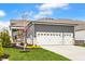 Three car garage and driveway with gorgeous landscaping at 1395 Chatham Hills Blvd, Westfield, IN 46074