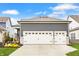Three car garage, long driveway with beautiful lawn and garden at 1395 Chatham Hills Blvd, Westfield, IN 46074