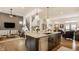Kitchen island overlooks the home's open concept living and dining areas at 1395 Chatham Hills Blvd, Westfield, IN 46074