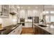Modern kitchen featuring stainless steel appliances, a breakfast bar, and sleek countertops at 1395 Chatham Hills Blvd, Westfield, IN 46074