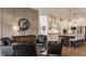 Open-concept living room with hardwood floors, neutral wall colors, and seamless access to the modern kitchen at 1395 Chatham Hills Blvd, Westfield, IN 46074