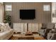 Comfortable living room with a decorative cabinet, large screen TV, and cozy seating at 1395 Chatham Hills Blvd, Westfield, IN 46074