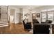 Inviting living room with hardwood floors, neutral walls, and comfortable seating around the foyer at 1395 Chatham Hills Blvd, Westfield, IN 46074
