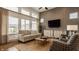 Bright living room with a gray accent wall and stairs to the second story at 1395 Chatham Hills Blvd, Westfield, IN 46074