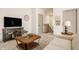 Spacious living room featuring an entertainment center and a staircase to the next level at 1395 Chatham Hills Blvd, Westfield, IN 46074