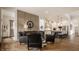Open-concept living room with hardwood floors, neutral wall colors, and seamless access to the modern kitchen at 1395 Chatham Hills Blvd, Westfield, IN 46074