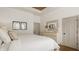 Comfortable main bedroom features a plush bed, decorative mirror, and soft, natural lighting at 1395 Chatham Hills Blvd, Westfield, IN 46074