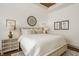 Bright main bedroom featuring a plush bed, tray ceiling, and stylish decor with lots of natural light at 1395 Chatham Hills Blvd, Westfield, IN 46074