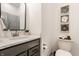 Half bathroom featuring a gray vanity, contemporary black mirror and decor at 1395 Chatham Hills Blvd, Westfield, IN 46074