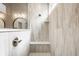 Luxurious walk-in shower with tiled walls, shower bench, and a seamless glass divider at 1395 Chatham Hills Blvd, Westfield, IN 46074