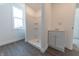 Bathroom featuring a new vanity, modern faucet, and shower with a white shower surround at 1403 Lafayette Ave, Columbus, IN 47201