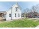 Charming two-story home with new siding, manicured lawn, and inviting curb appeal at 1403 Lafayette Ave, Columbus, IN 47201