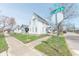 Inviting two-story home with mature trees, sidewalk, and street sign on a sunny day at 1403 Lafayette Ave, Columbus, IN 47201