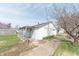 View of a detached garage showing a white exterior with an alleyway behind the home at 1403 Lafayette Ave, Columbus, IN 47201