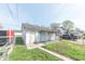 View of detached garage with fenced in area with access from the back alleyway at 1403 Lafayette Ave, Columbus, IN 47201