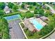Aerial view of community pool, tennis courts, playground, and parking lot at 14720 Warner Trl, Westfield, IN 46074