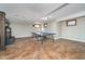 Finished basement area featuring a ping pong table and ample lighting at 14720 Warner Trl, Westfield, IN 46074