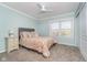 Relaxing bedroom boasting soft walls, neutral carpet, a plush bed and a sunny window view at 14720 Warner Trl, Westfield, IN 46074