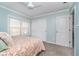Comfortable bedroom with a ceiling fan, double closet, and plush carpet at 14720 Warner Trl, Westfield, IN 46074