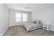 Bright bedroom with neutral walls, carpet flooring, a ceiling fan, and a window offering natural light at 14720 Warner Trl, Westfield, IN 46074