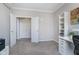 Neutral bedroom featuring carpet floors, closet, and custom shelving; perfect for a home office or guest room at 14720 Warner Trl, Westfield, IN 46074