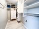 Walk-in closet with custom shelving and drawers for easy storage and organization of clothes and personal items at 14720 Warner Trl, Westfield, IN 46074
