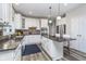 Updated kitchen features granite counters, a center island, and stainless steel appliances at 14720 Warner Trl, Westfield, IN 46074