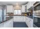 Kitchen with stainless steel appliances and granite counters, complemented by natural light at 14720 Warner Trl, Westfield, IN 46074