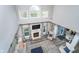 Open-concept living room showcases a fireplace, neutral decor, and a view of the outdoors at 14720 Warner Trl, Westfield, IN 46074