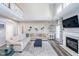 Bright living room features a fireplace, large sofa, high ceilings, and decorative artwork at 14720 Warner Trl, Westfield, IN 46074