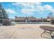 Community pool surrounded by lounge chairs and a large building for resident enjoyment at 14720 Warner Trl, Westfield, IN 46074