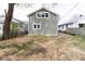 View of the home's siding and backyard showcasing the size of the backyard at 1515 Dawson St, Indianapolis, IN 46203