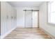 Bedroom with unique sliding barn door leading to the bath and closet storage at 1515 Dawson St, Indianapolis, IN 46203