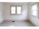 Bright bedroom featuring neutral carpet, white walls and trim, and natural light at 1515 Dawson St, Indianapolis, IN 46203