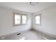 Bright bedroom featuring neutral carpet, white walls and trim, and natural light at 1515 Dawson St, Indianapolis, IN 46203